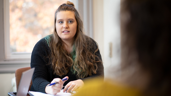 Psychology student talking with fellow student