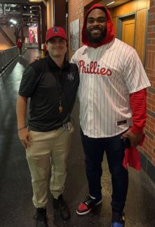 Mason Broomall with Eagles defensive end Brandon Graham at Citizens Bank Park