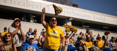 widener families cheer in stadium at homecoming