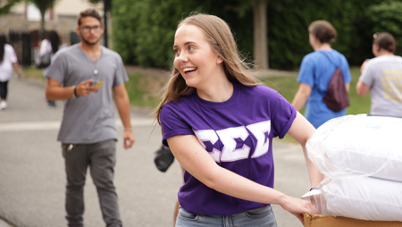 Student moving into dorm room