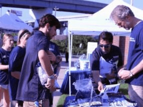 Students and Staff working a table at the Philadelphia Union stadium